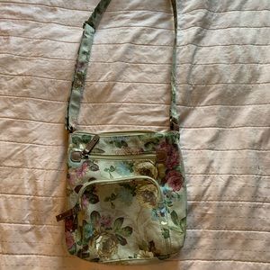 Floral side bag with three pockets.